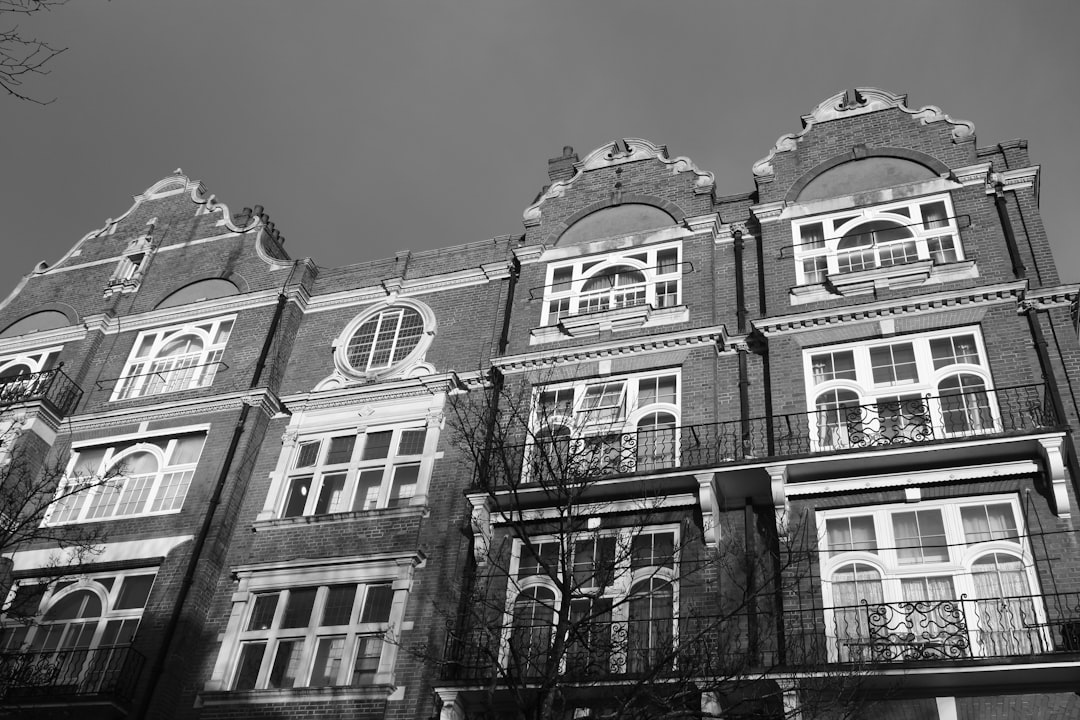Ornate Brick Residential Buildings Ornate brick building with arched windows and balconies.