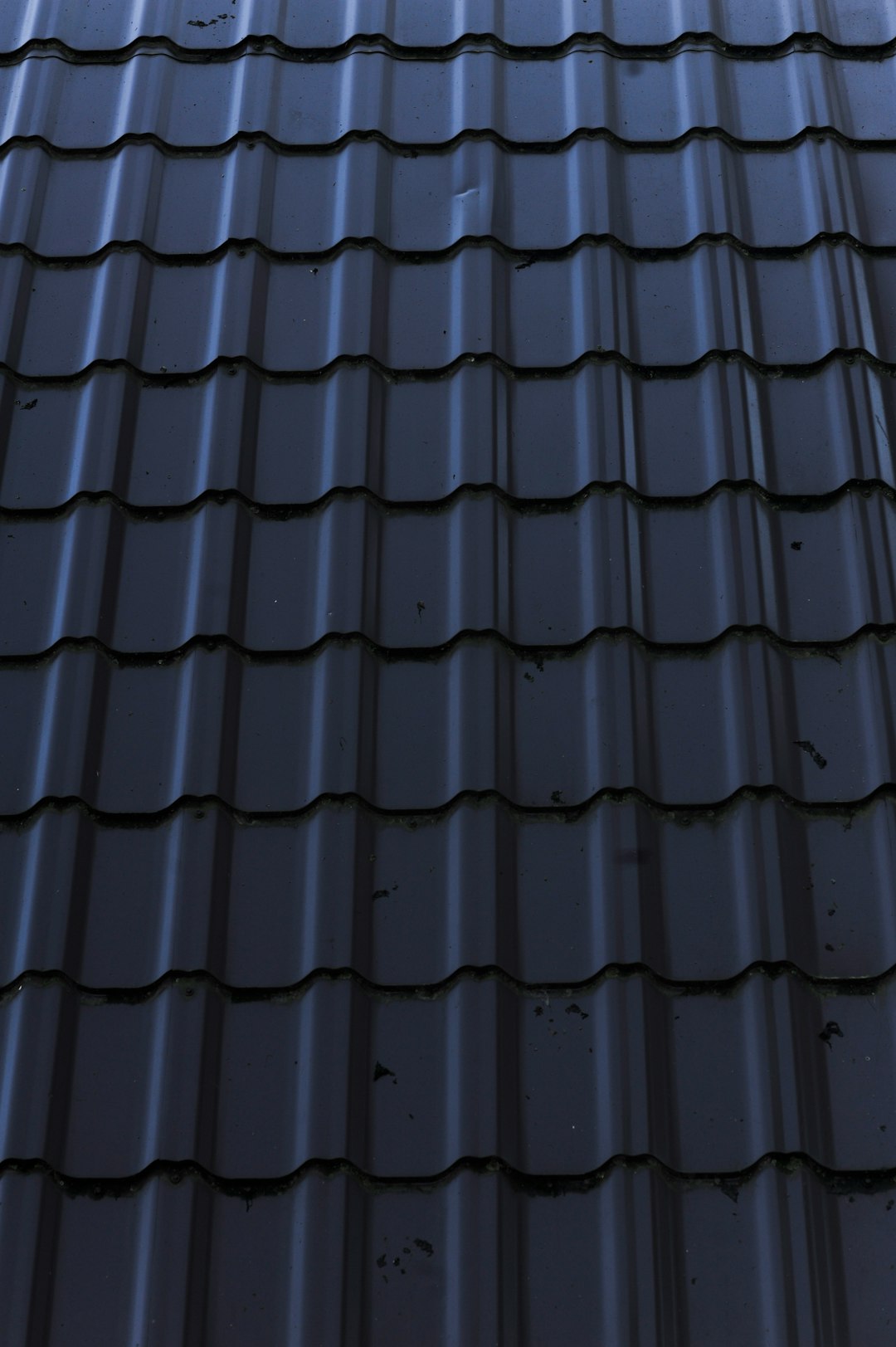 Close-Up of Metal Roof a close up of a metal roof with a sky background