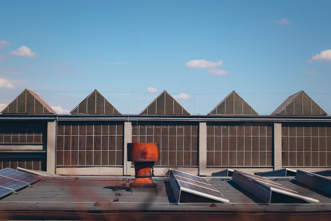 Industrial building with sawtooth roof and sky