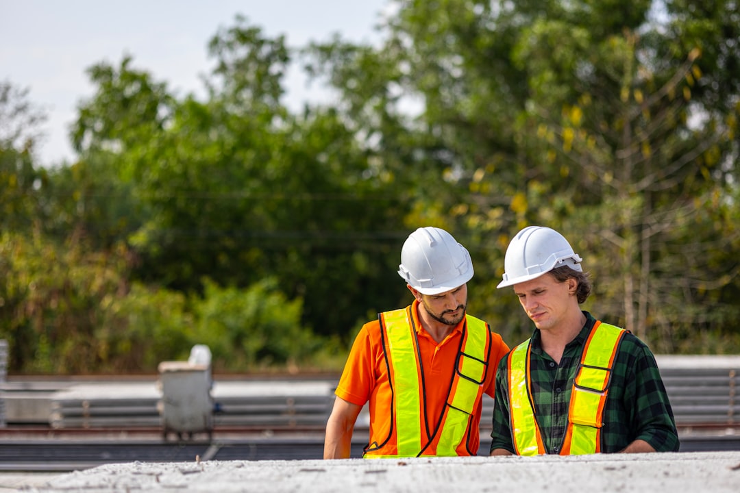 Construction Workers on Site Construction workers examine plans on site.