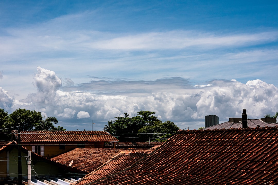 Rooftops under a dramatic cloudy sky