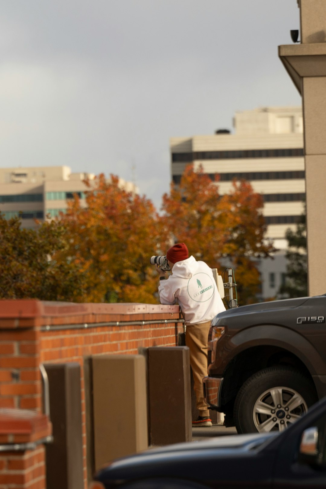 A man standing on the back of a truck