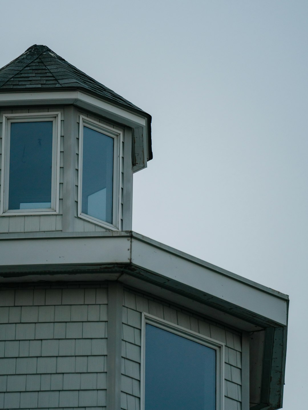 Gray House Turret Close-Up Close-up of a gray house with a hexagonal turret.