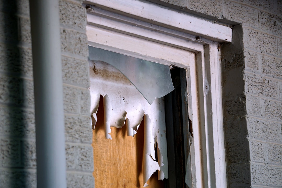 Damaged Window on Concrete Wall cracked window panel
