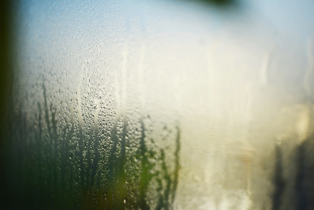 a close up of a window with rain drops