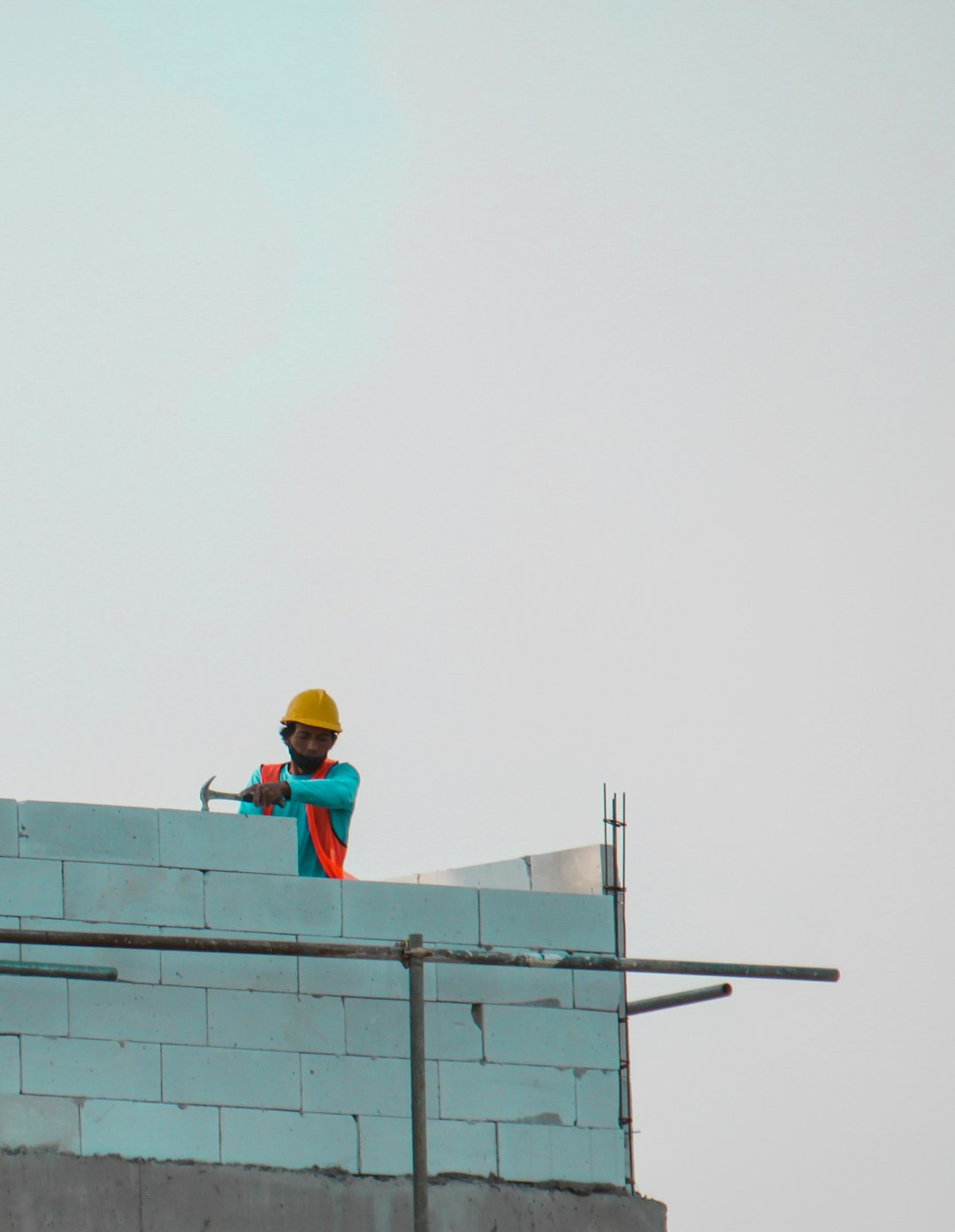 a construction worker on top of a building