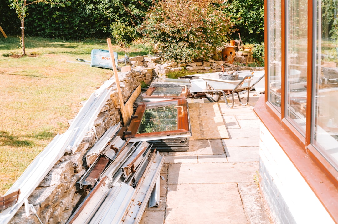 Sunny Patio with Stacked Materials Sunny patio with stacked materials and cold frames