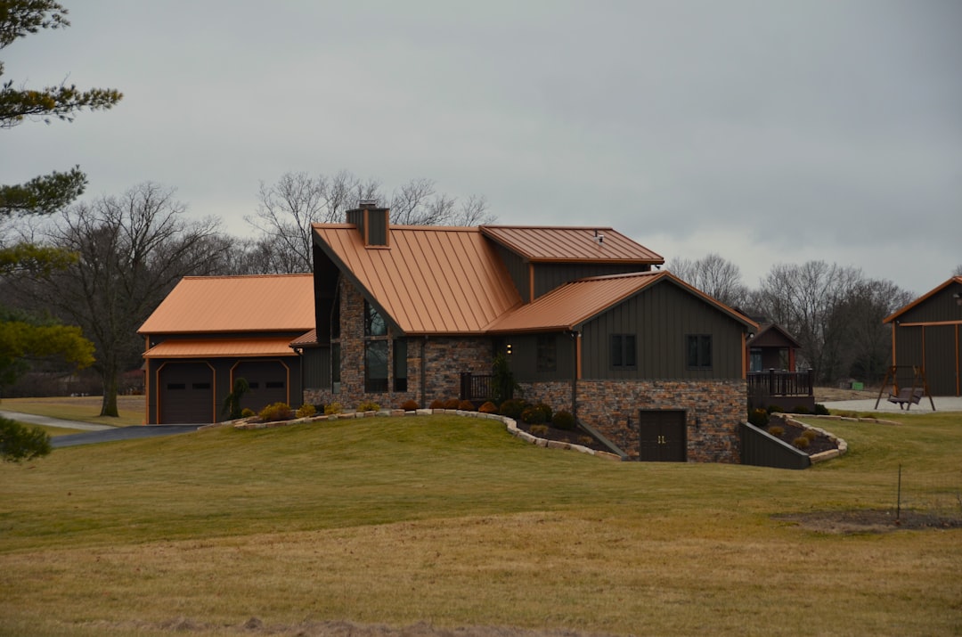 a large house with a brown roof and a brown roof