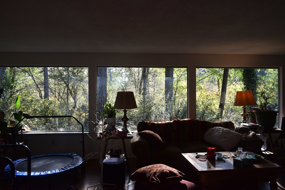 A living room filled with furniture and lots of windows