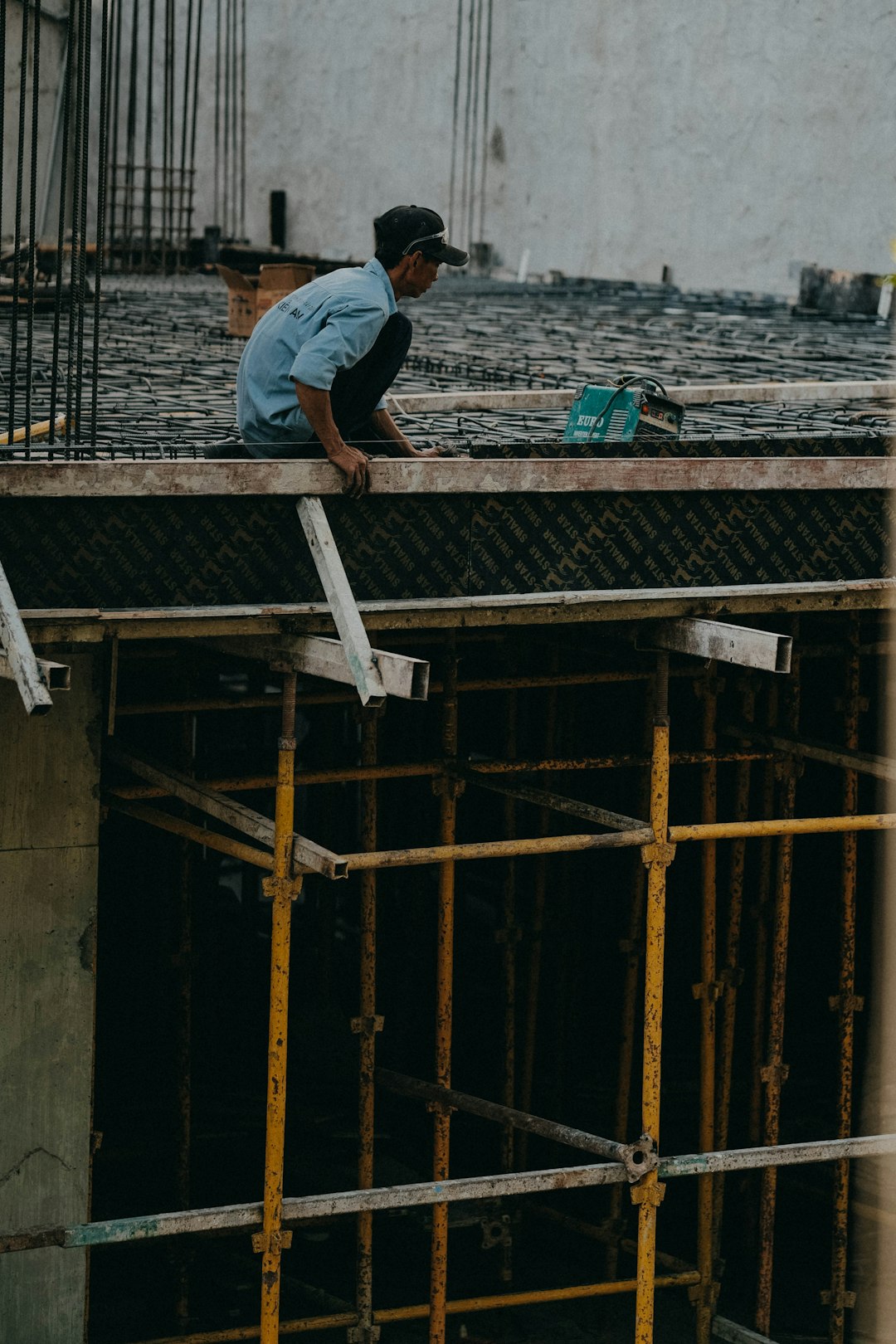 a man working on a building under construction