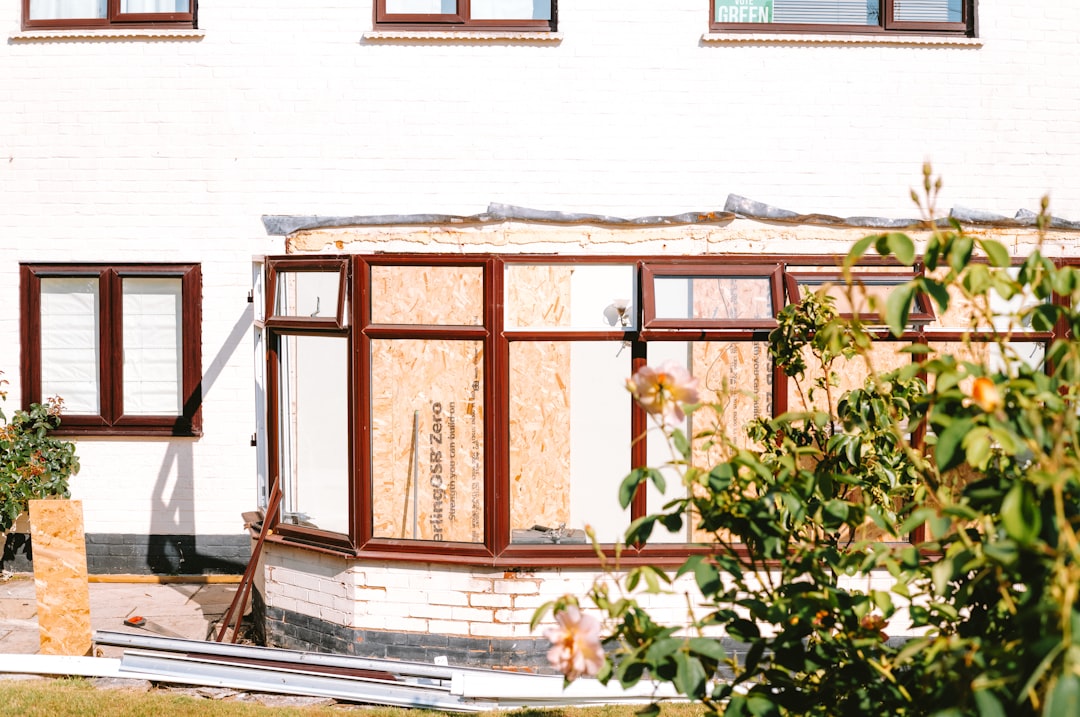House with boarded-up conservatory windows