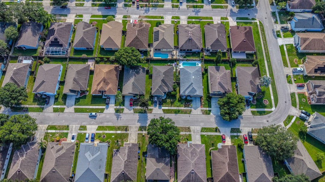 Residential neighborhood with houses, streets, and a backyard swimming pool