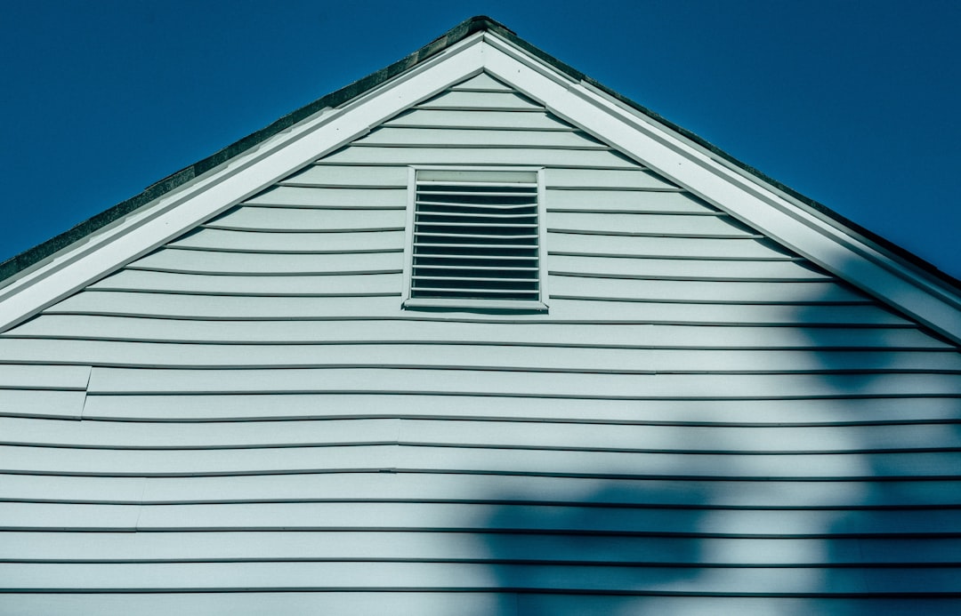 Residential Roofing Project white wooden house under blue sky during daytime