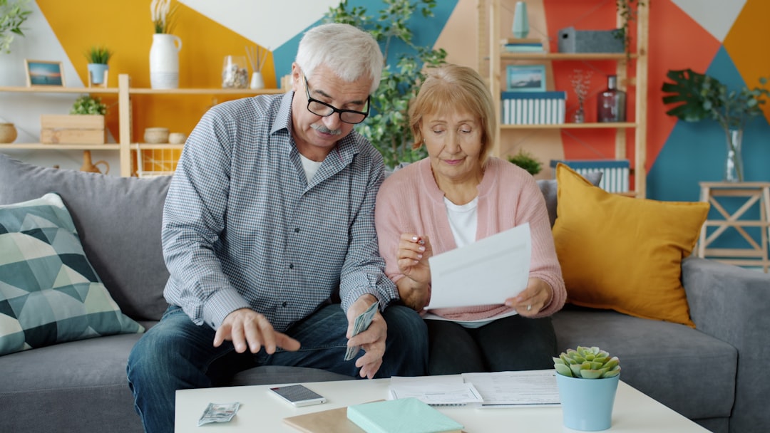 1a0b63d6975243119a7cc3981f2793ac Elderly couple reviewing documents at home