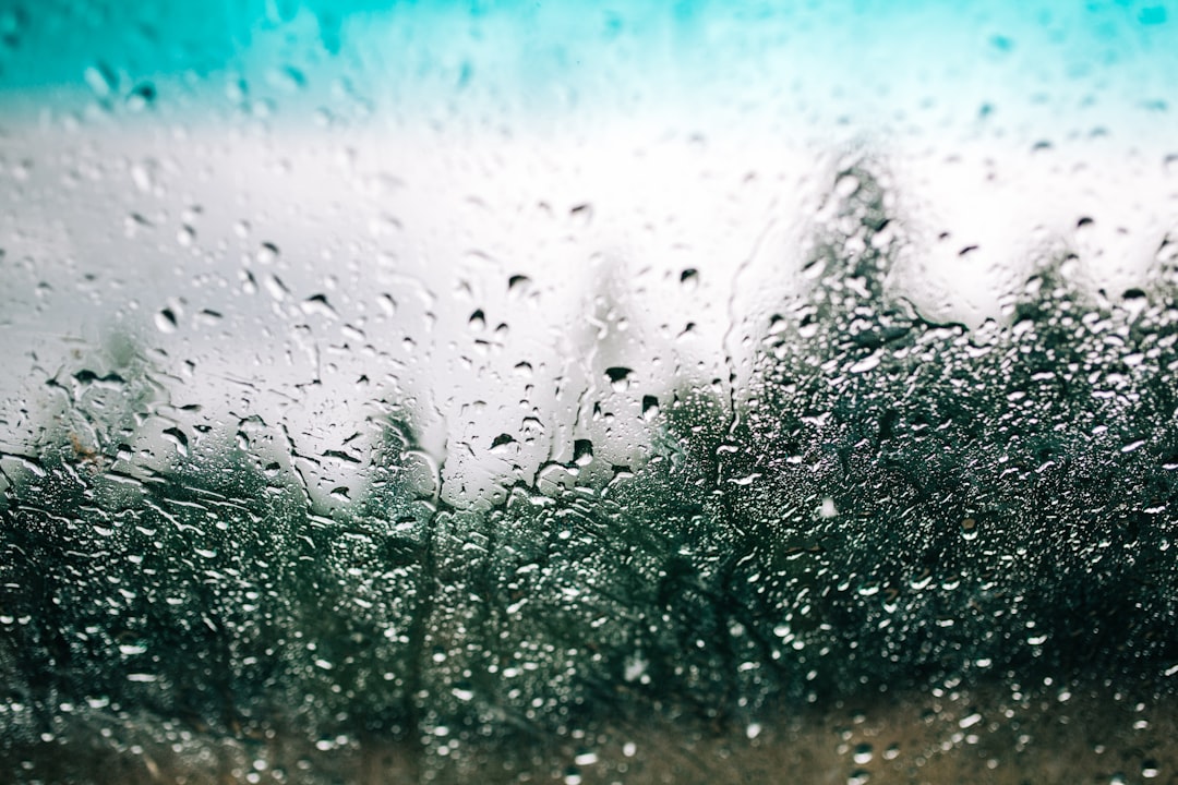 2da935f3ae1c45e3879e94e05faf93fe a window with rain drops on it