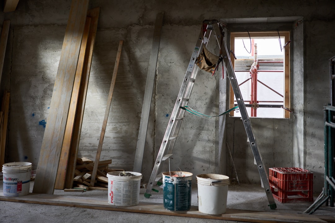 Construction Interior with Ladder and Buckets a ladder and buckets of paint in a room under construction