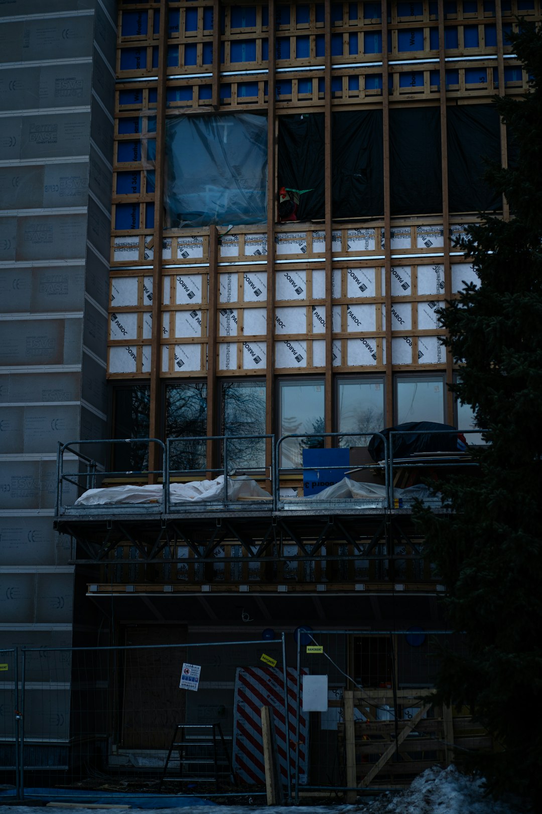 Building facade undergoing renovation and construction.