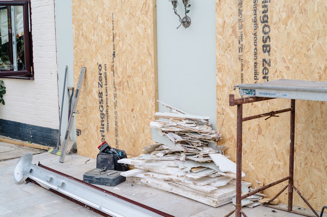 6238d166dde34c529d1c2496a9ba941b Building renovation with wooden panels and construction debris