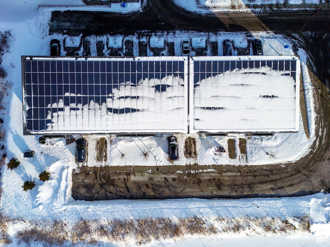 6ac296febf5044b18d3971cad11ea29a Rooftop solar panels partially covered in snow