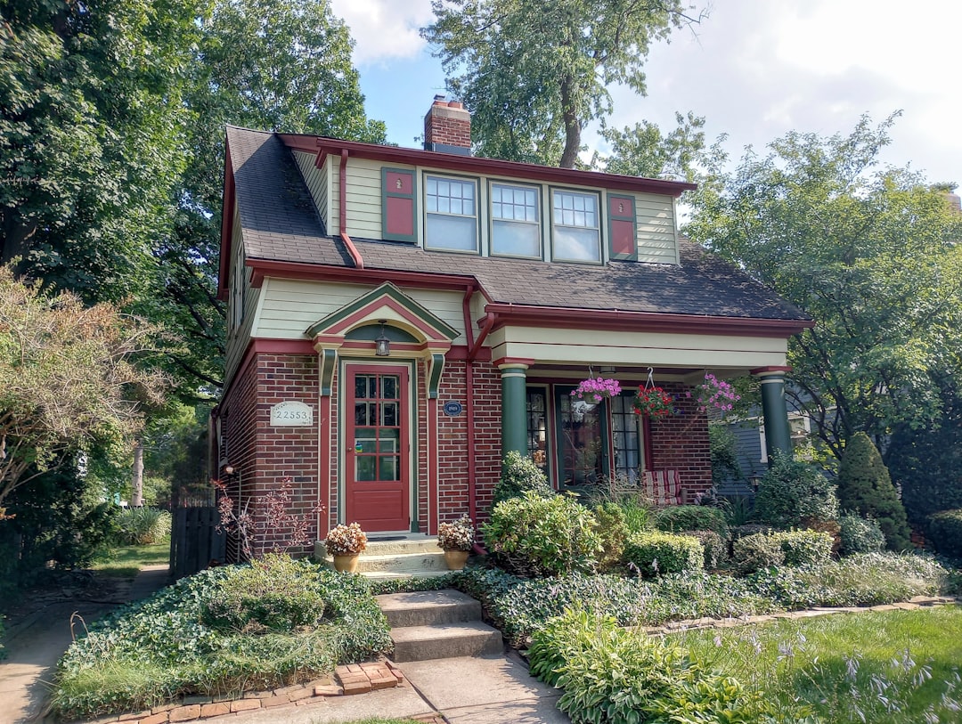 Two-Story House with Red Door a red brick house with a red front door