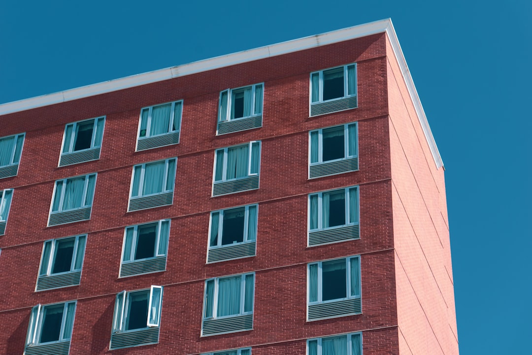 Red Brick Apartment Building a tall red brick building with lots of windows