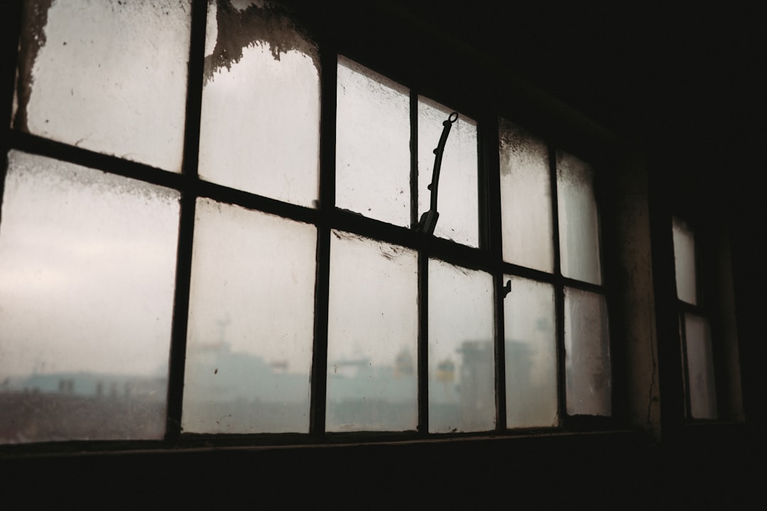 8b8c237c5e2c4dc78479d199e01a192f Old, dirty window panes with light filtering through