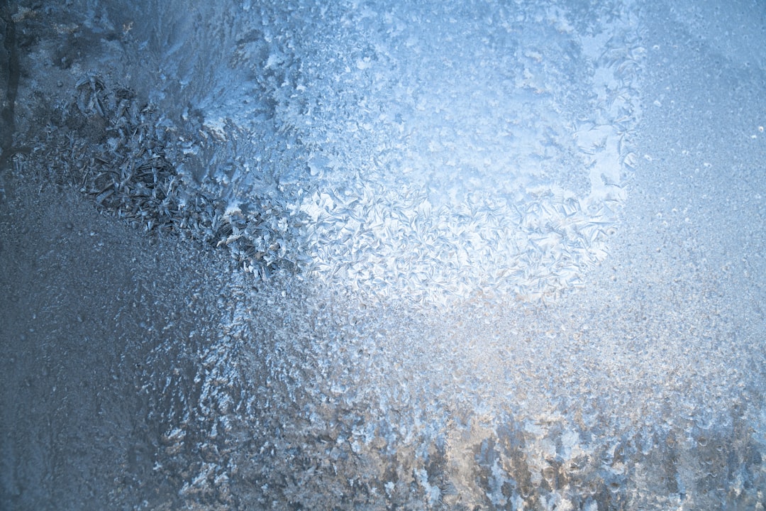 Frosted Window Pane A close up of a window with frost on it