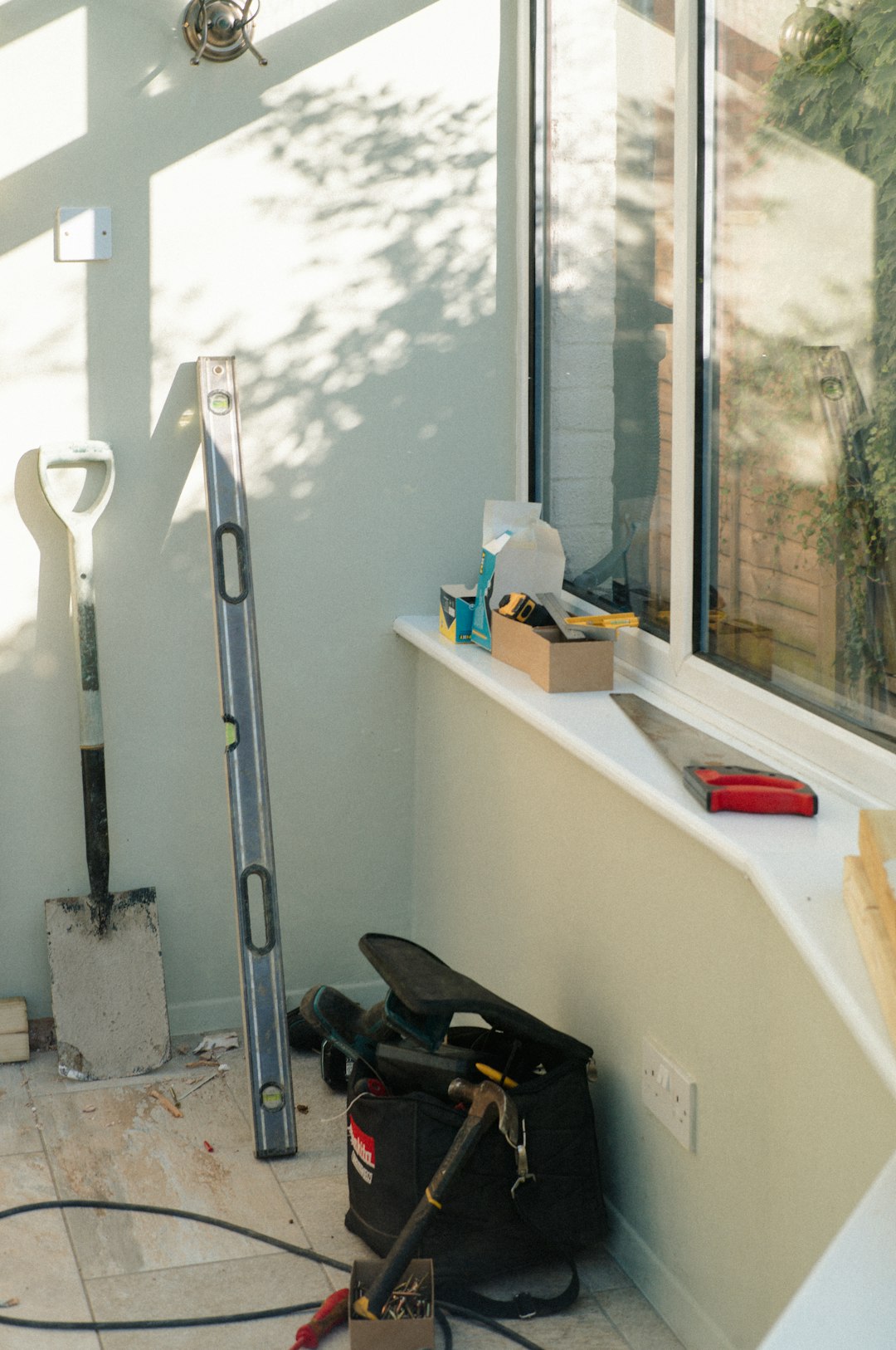 Construction tools and equipment in a sunlit room