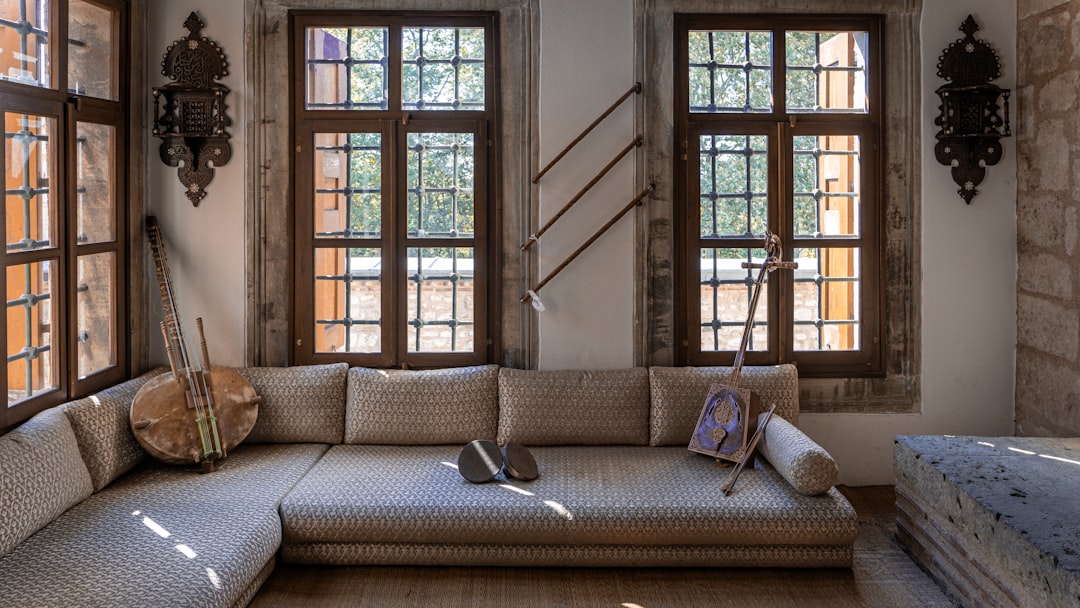 L-shaped sofa with instruments and windows