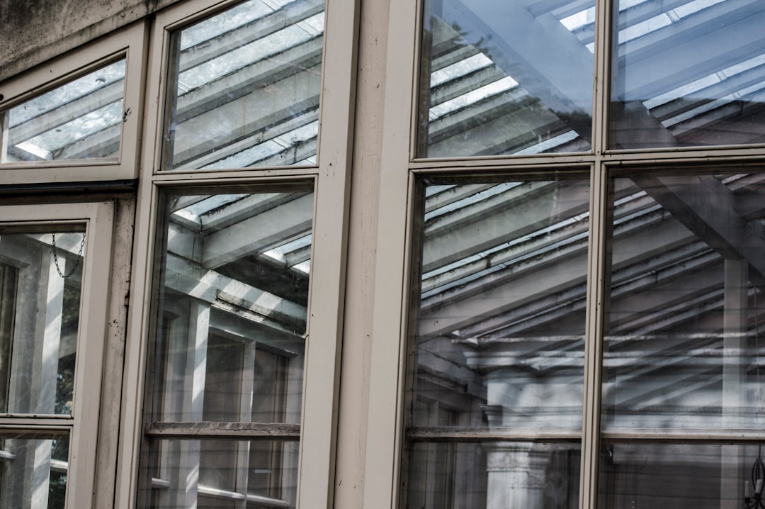 brown wooden framed glass window