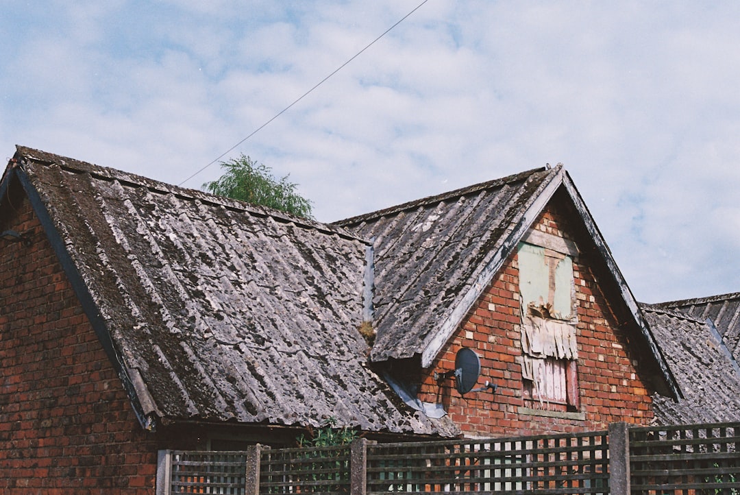 Old brick building with a weathered roof