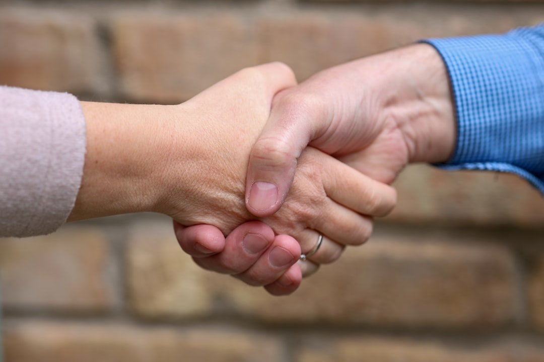 Two people are shaking hands