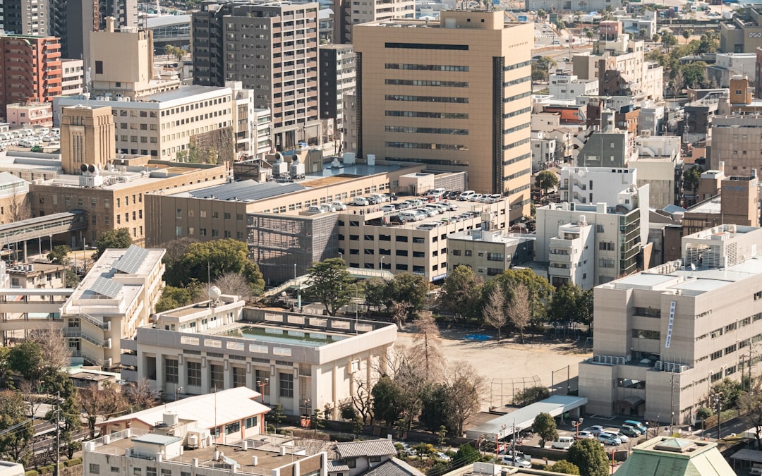 a950208ca61b46eea02edc7e92a68360 Modern cityscape with tall buildings and trees