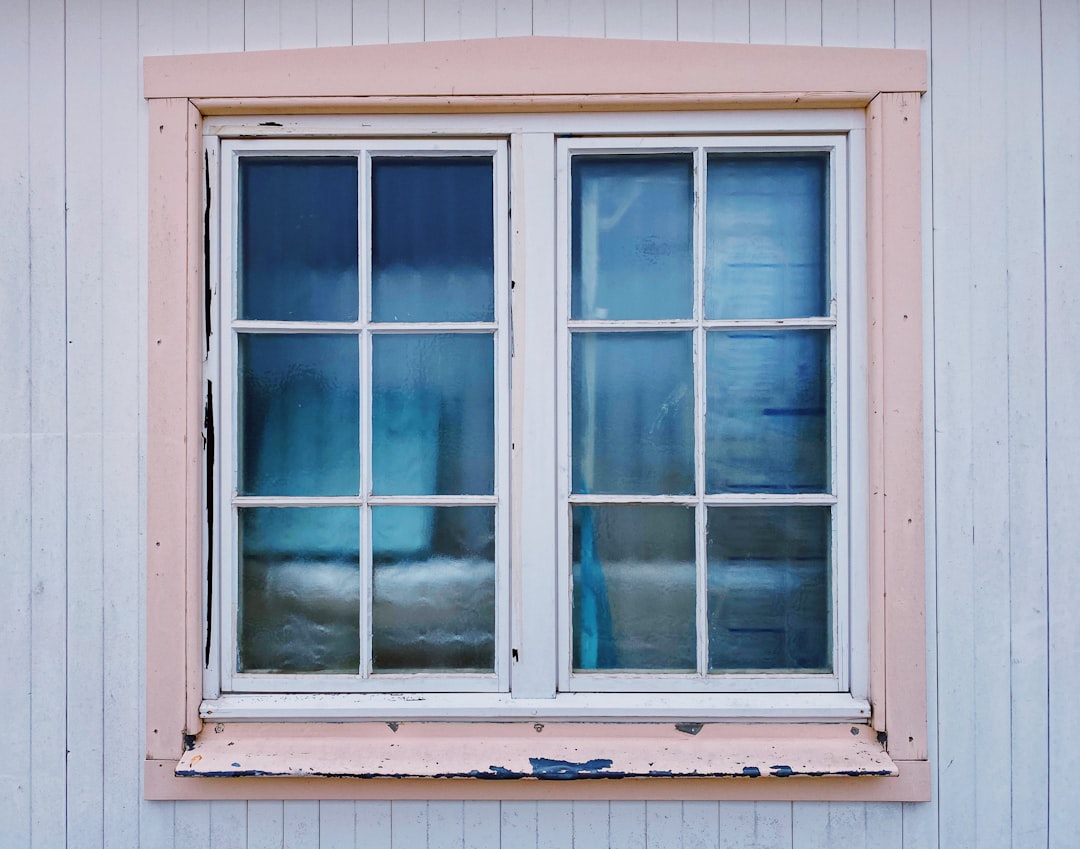 Adjacent Windows with Grid Panes white wooden framed glass window