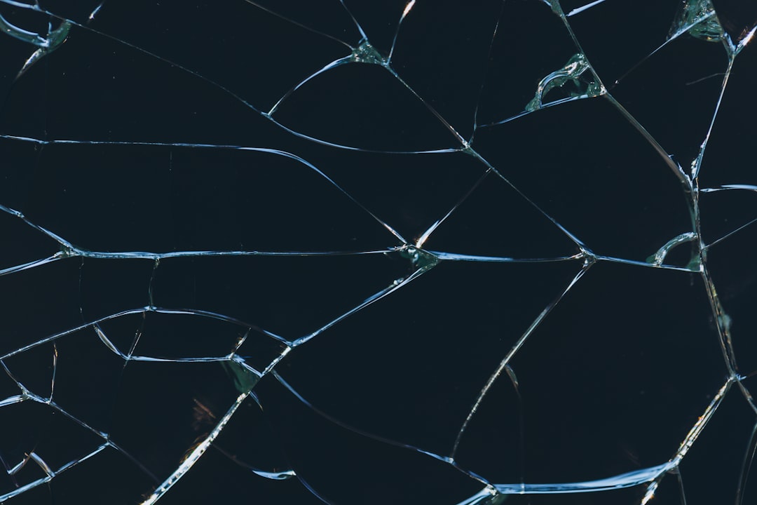 A close up of a broken glass window