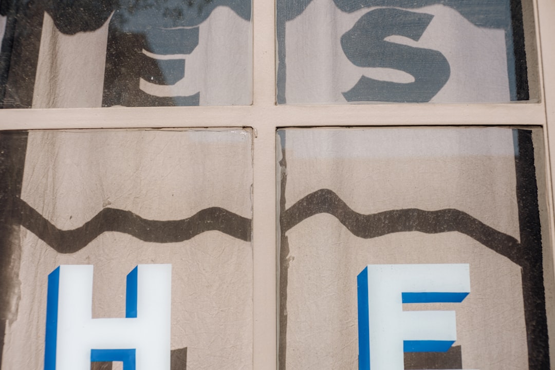 A close up of a window with a sign on it