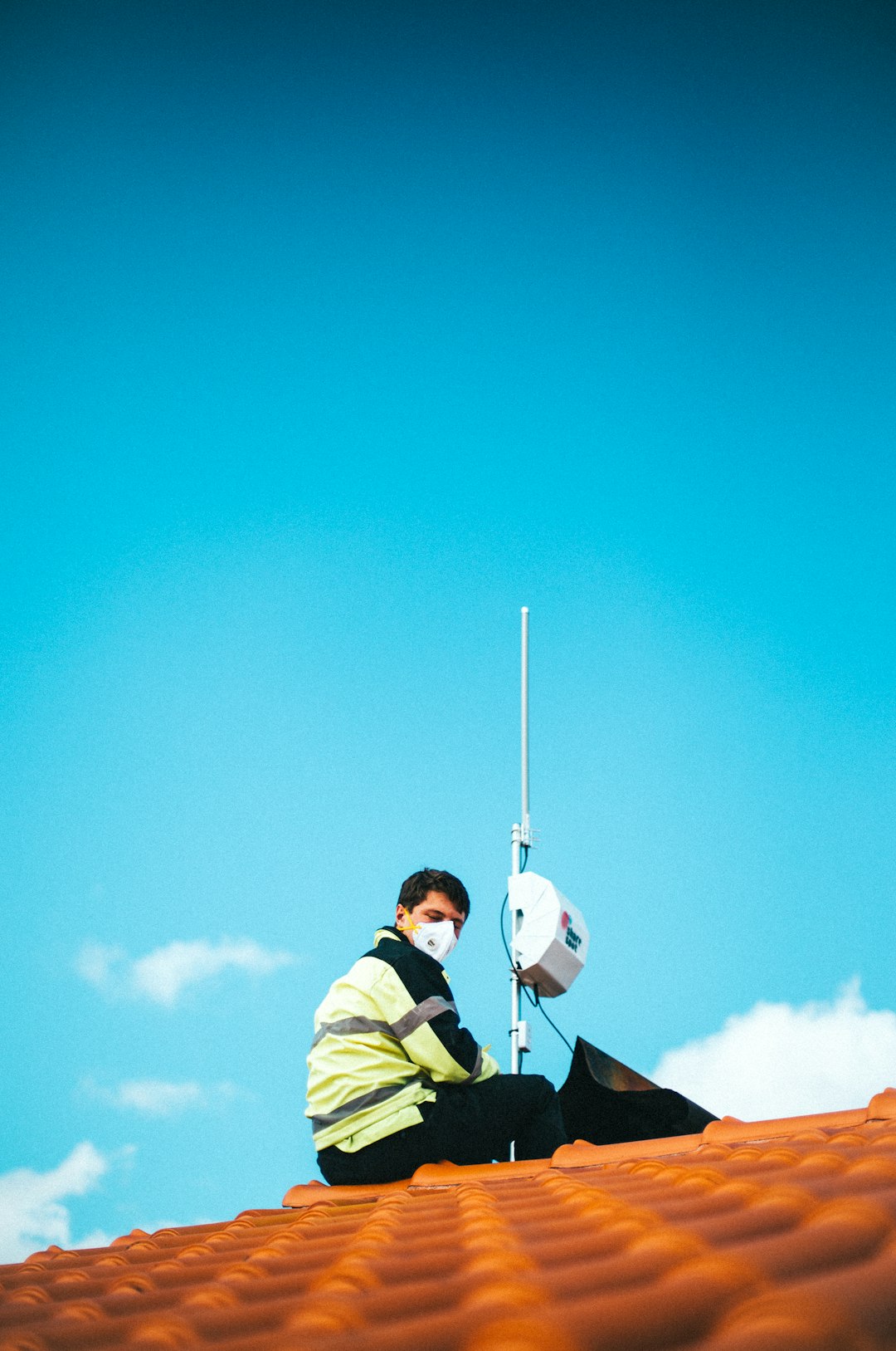 a man in a blue sky