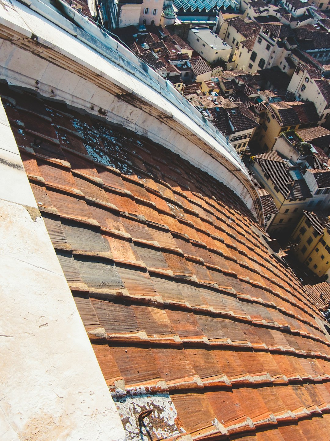 Terracotta tiled roof overlooking a city