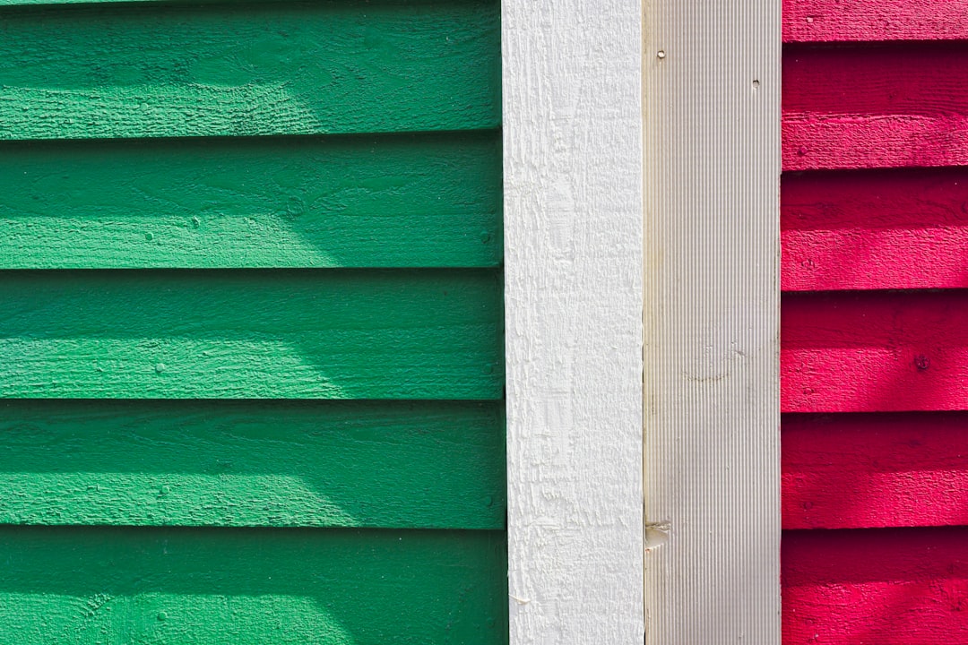 a close up of a red and green building