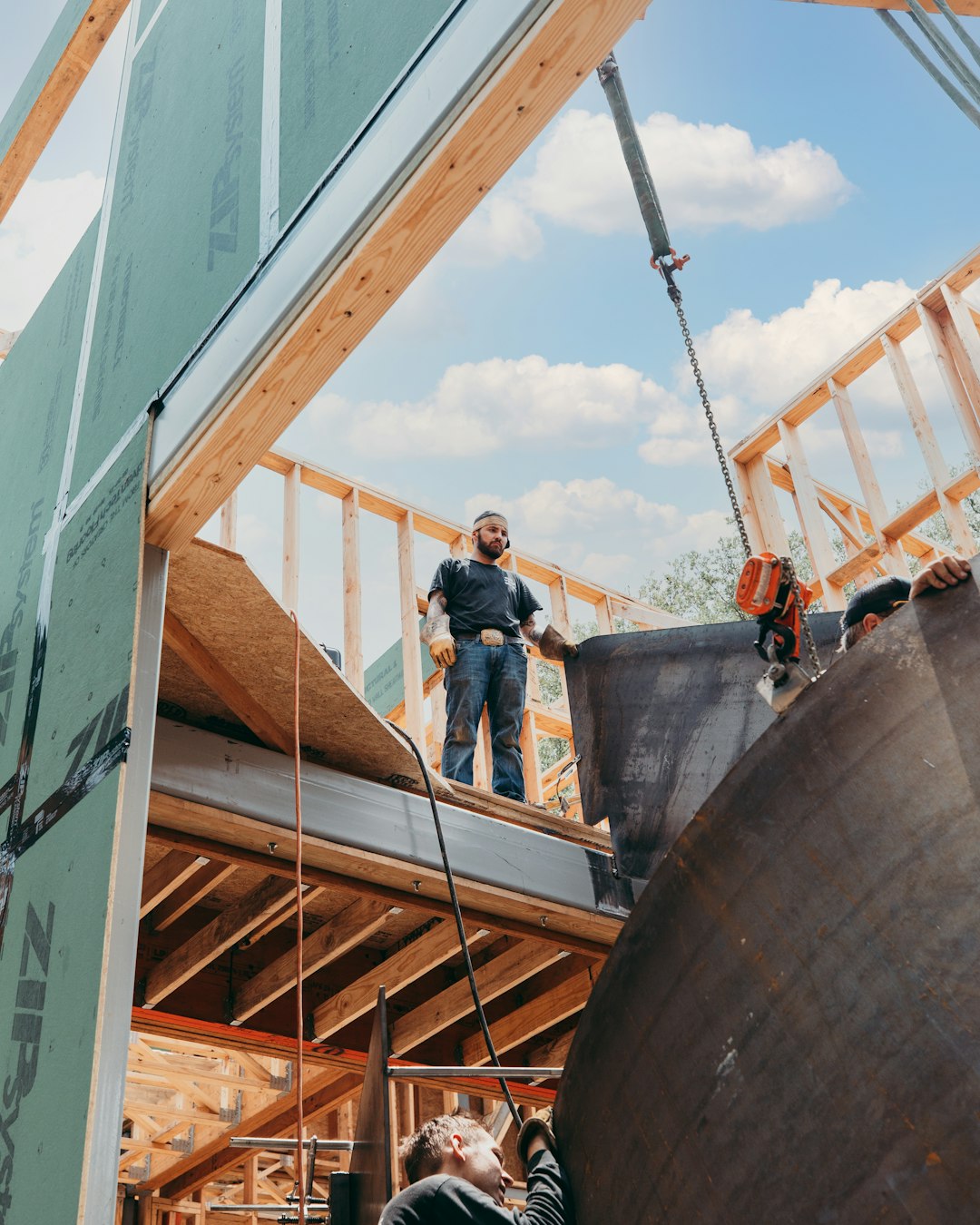 caa662be3d284963a8ab3d80bd32929f a man standing on top of a wooden structure