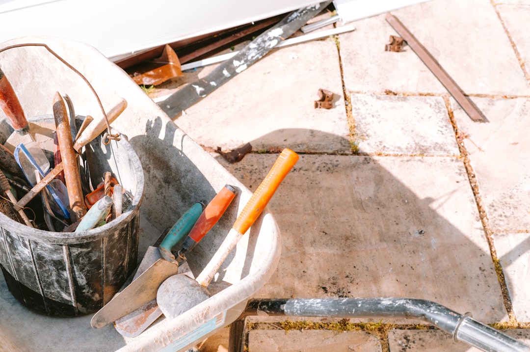 d11f2cbc2b2c46049ad745be70b5eabc Assortment of construction tools on a building site