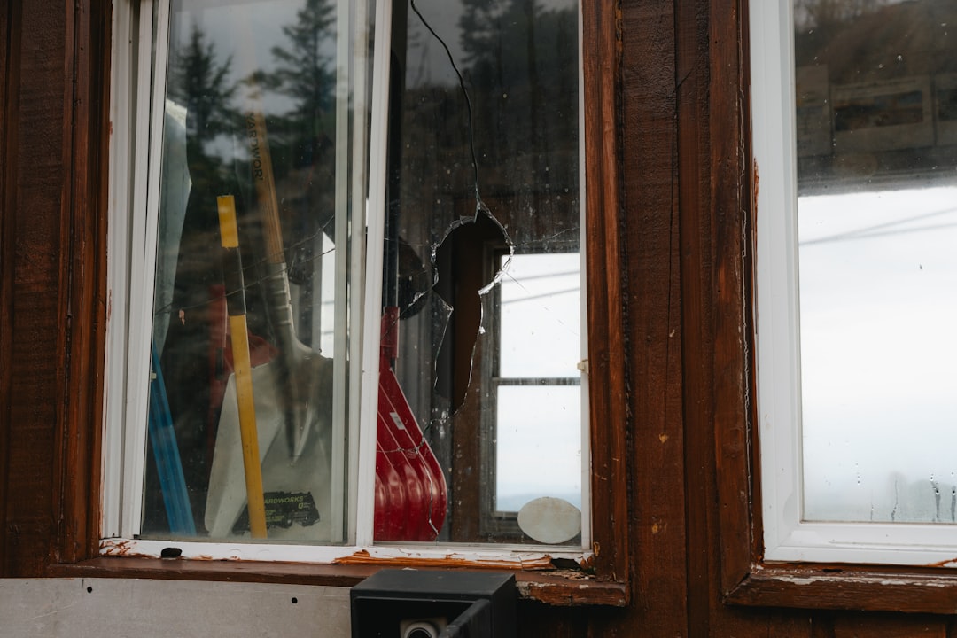 Broken window pane on a wooden building