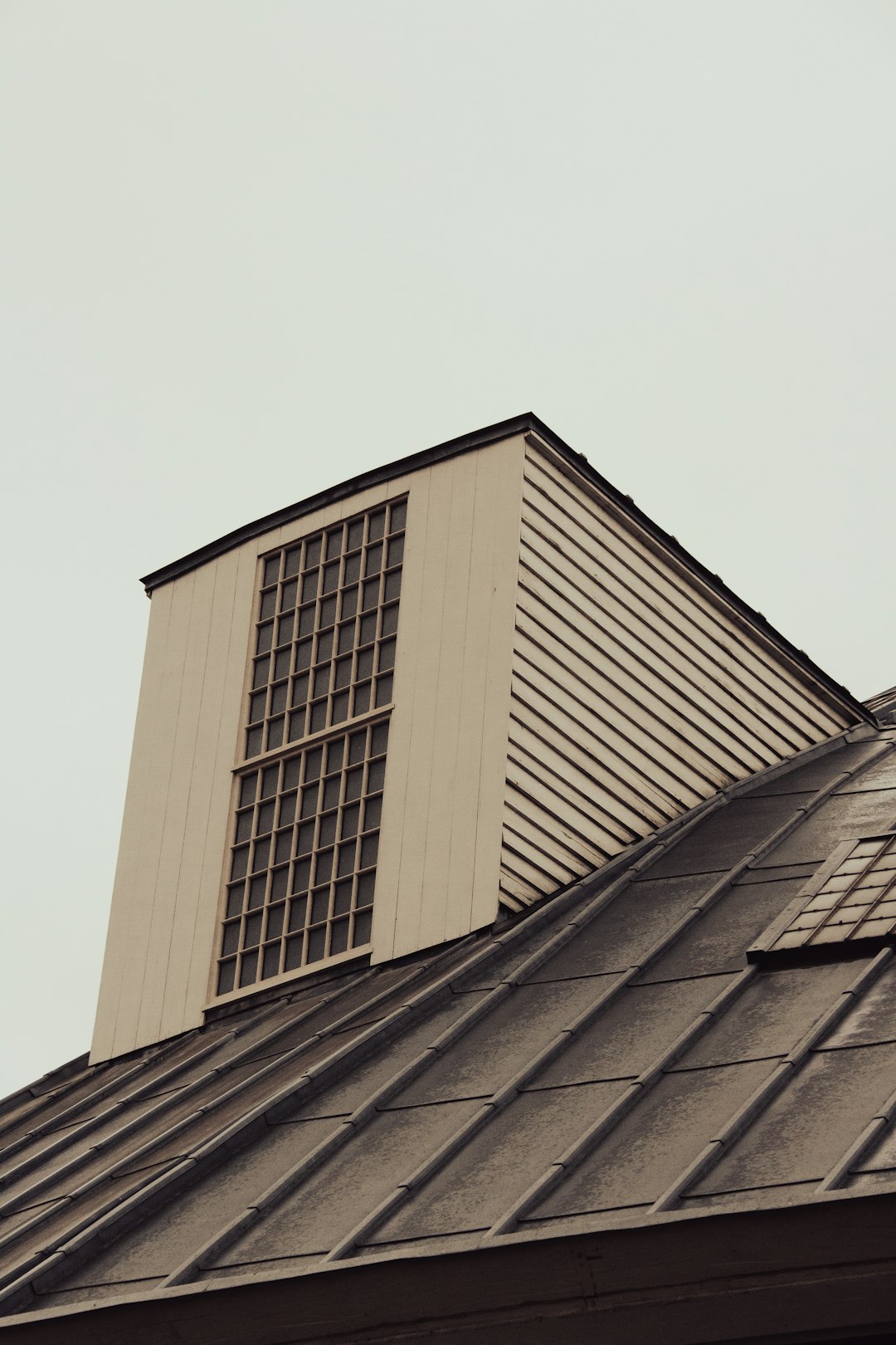 a tall building with a clock on the top of it