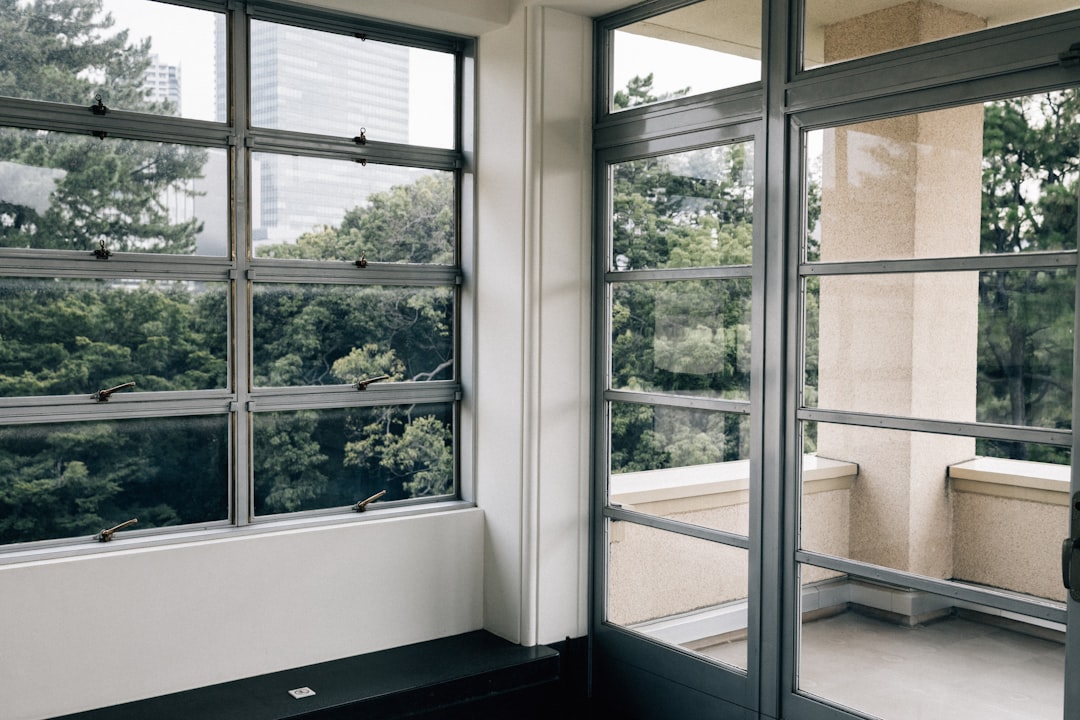 Modern Interior Room with Windows Modern building interior with large windows overlooking trees