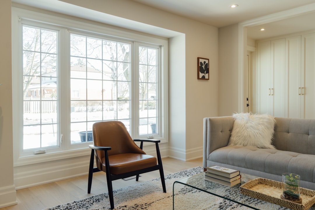 a living room filled with furniture and a large window