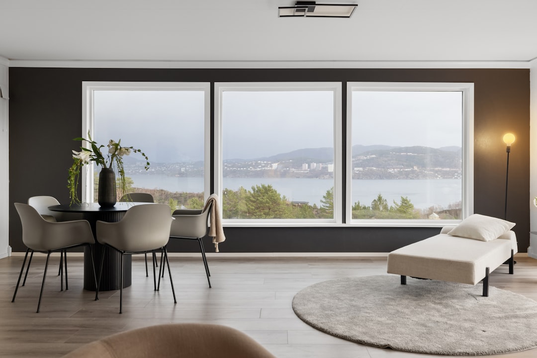 A living room filled with furniture and a large window