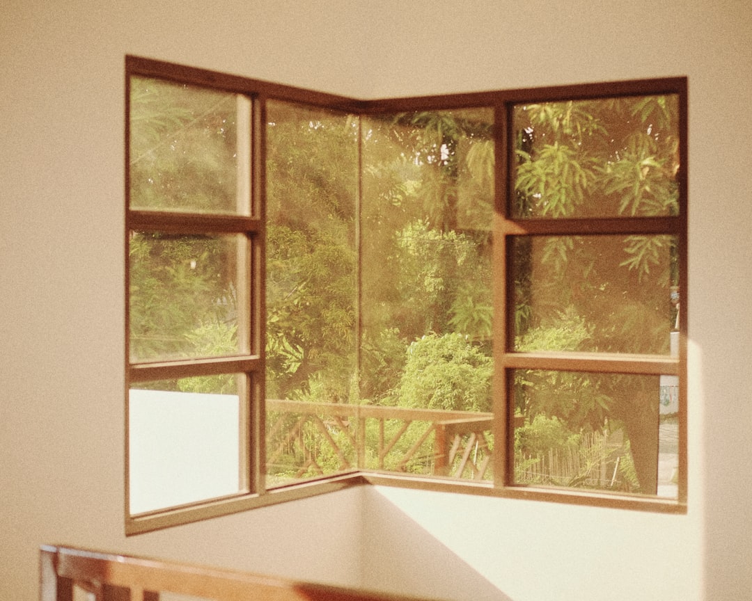 Corner window with view of trees and balcony