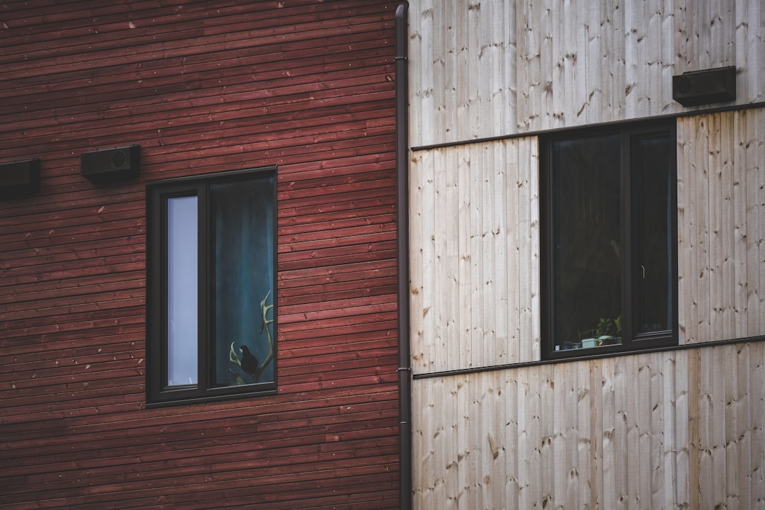 a red building with two windows next to each other