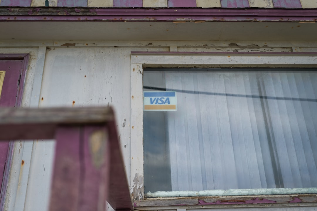 49e20314ba4240399f5f8e36de9e1776 a window with a sticker on the side of it