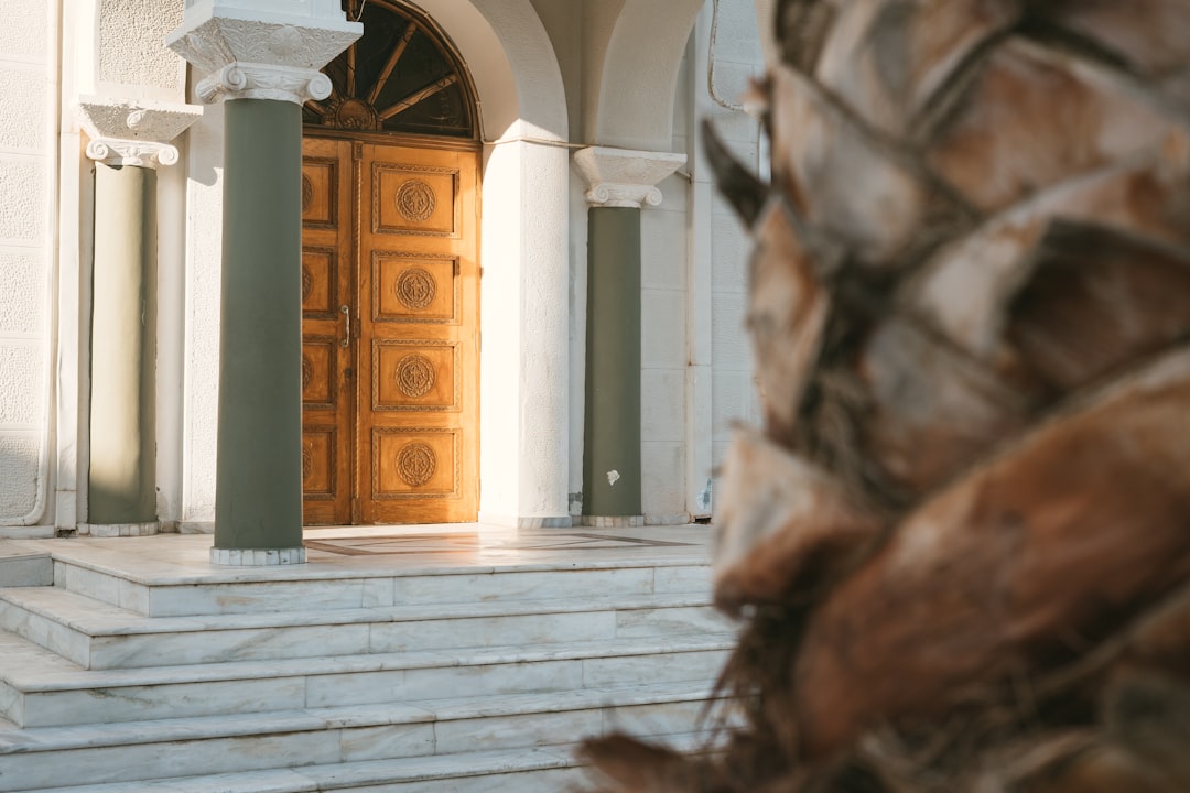 5015d21440af47dfb0216f03f90017f2 a large wooden door sitting inside of a building